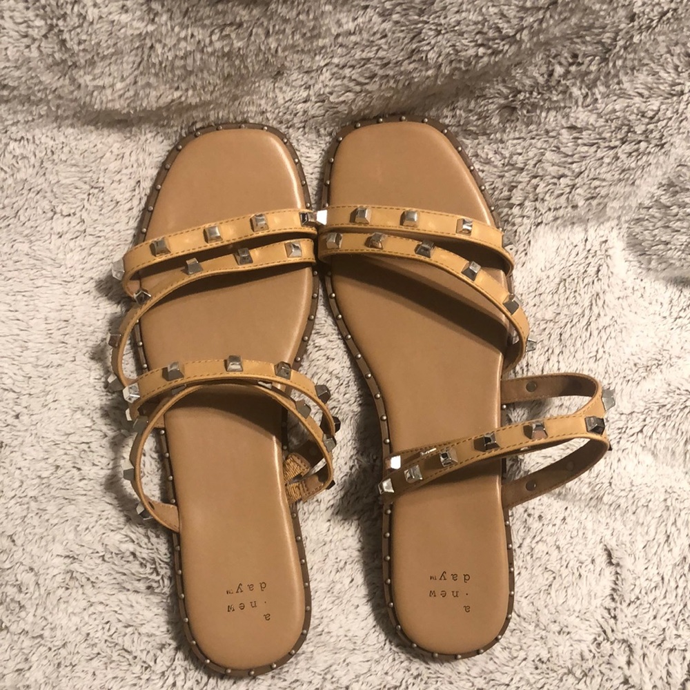 Brand new, never worn, Size 10 beige sandals with silver studs.